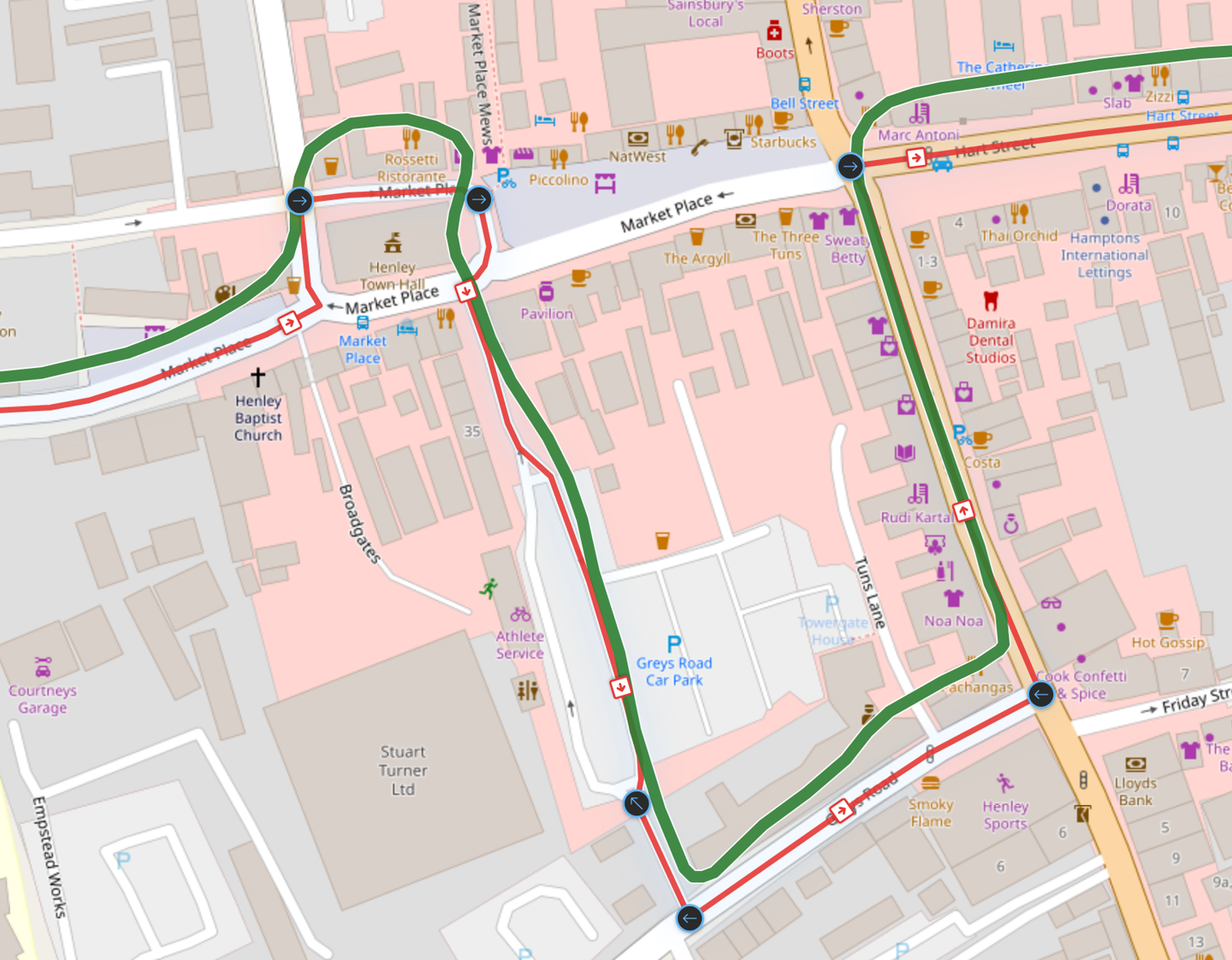 A map of Henley town centre. A wide green line wanders across Market Place and cuts the corner by the car park; a thin red line follows the actual streets alongside it, with blue turn markers at each junction