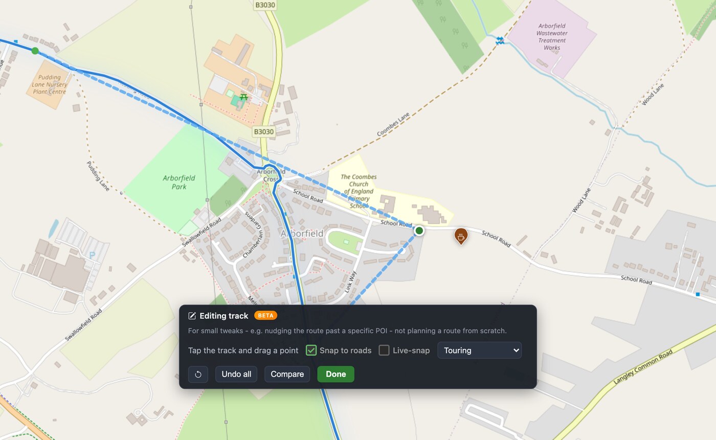 Dragging the track east toward the cafe: the proposed new path shows as a dashed line pinned between two fixed anchor points on the original route