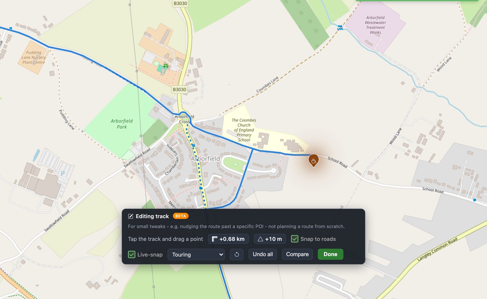 PitStopper map at Arborfield Cross: the blue route has been pulled east along School Road to pass a cafe, with the original path shown as a dotted line and an editing toolbar reading plus 0.68 km